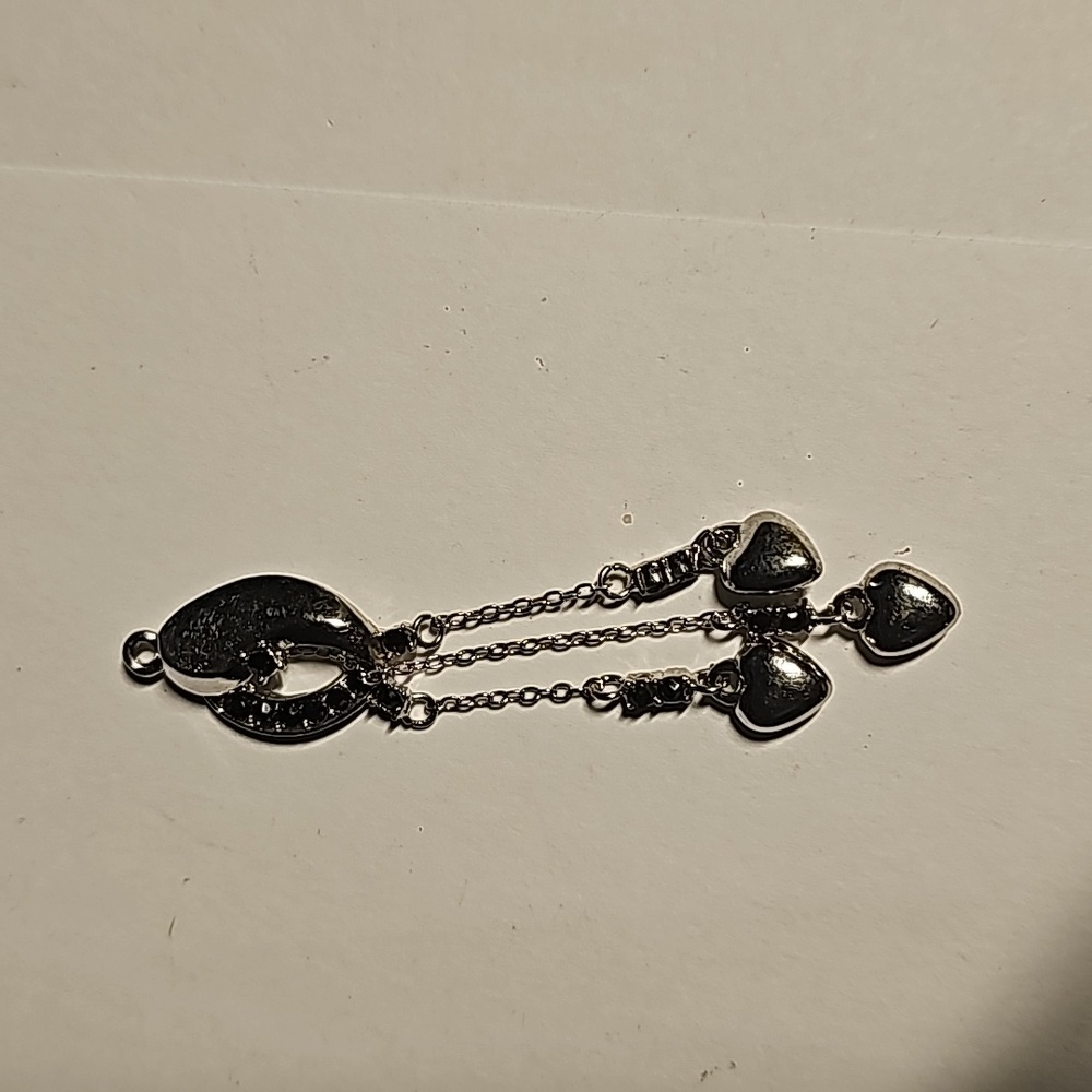 Silver heart charm with black onyx stones
